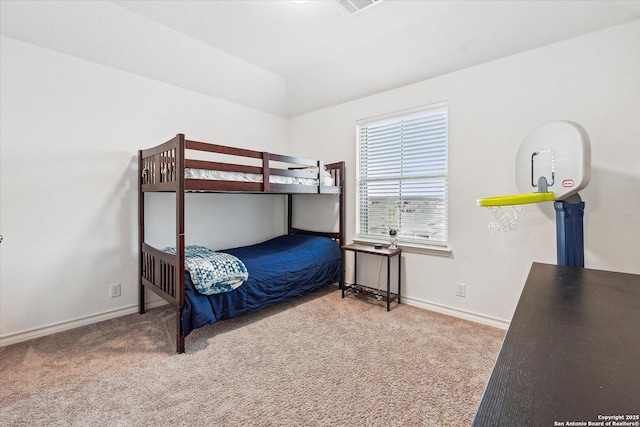 bedroom with carpet and vaulted ceiling