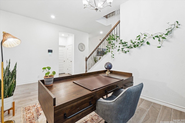 office space featuring light hardwood / wood-style flooring and a notable chandelier