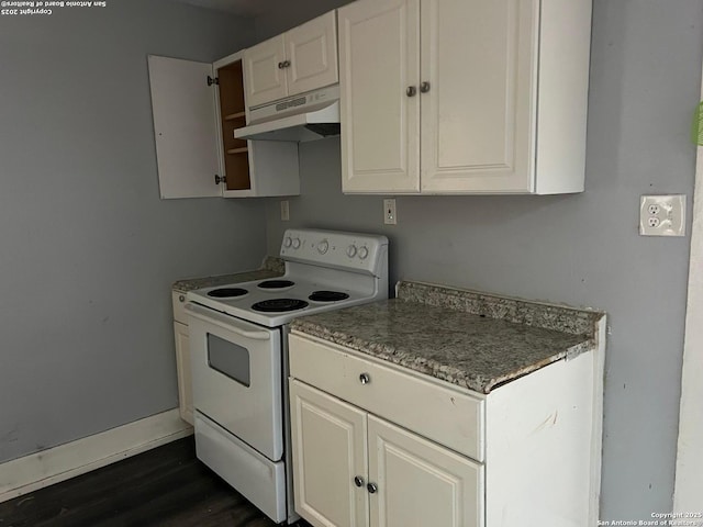 kitchen featuring white electric range, dark hardwood / wood-style flooring, and white cabinetry