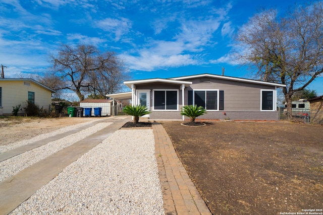 view of front of property featuring a carport