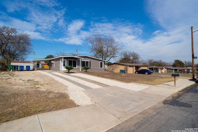 view of front facade featuring a carport