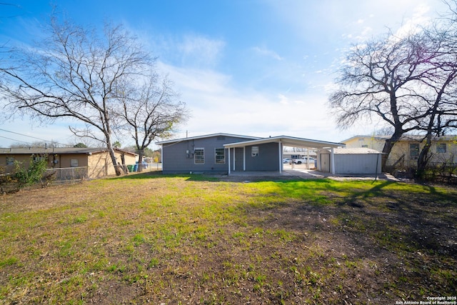 back of property featuring a yard