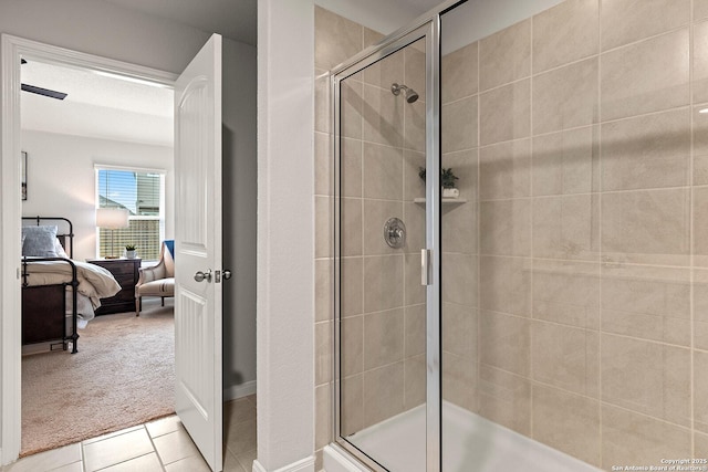 bathroom featuring tile patterned flooring and an enclosed shower