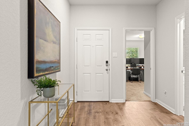 foyer with light wood-type flooring