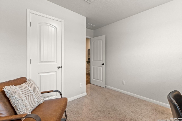 living area with a textured ceiling