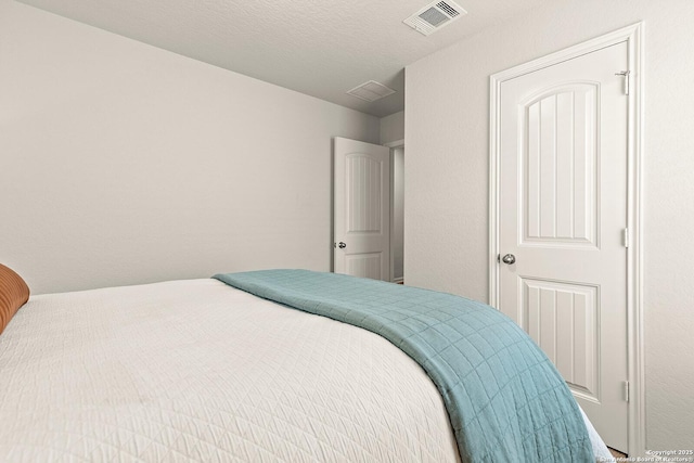 bedroom featuring a textured ceiling