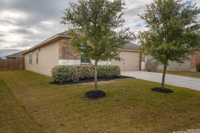 view of front of home with a front lawn and a garage