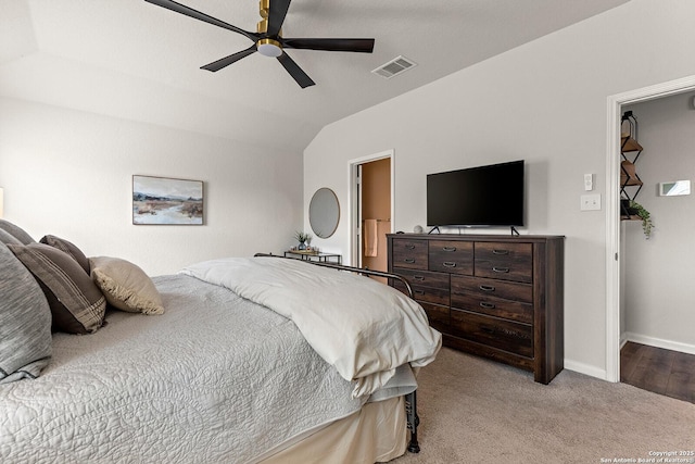 carpeted bedroom featuring ceiling fan and vaulted ceiling