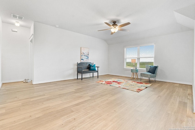 sitting room with ceiling fan, lofted ceiling, and light wood-type flooring