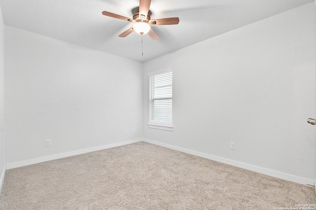 empty room with carpet and ceiling fan