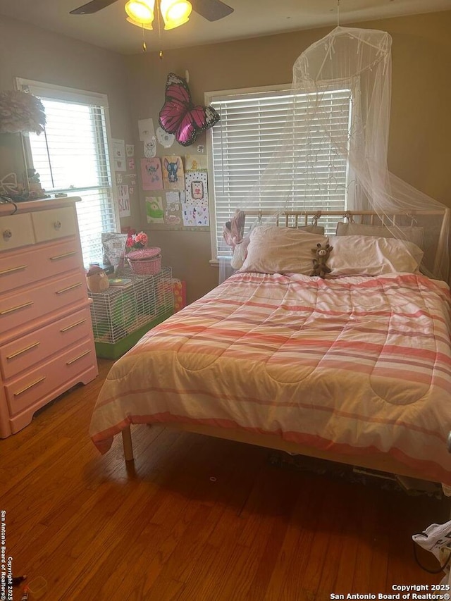 bedroom featuring ceiling fan and hardwood / wood-style floors