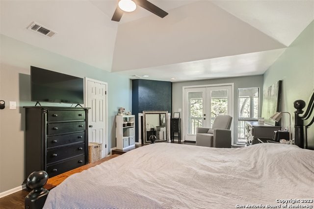 bedroom with ceiling fan, wood-type flooring, vaulted ceiling, and french doors