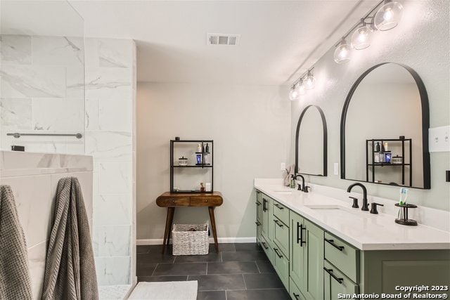 bathroom with vanity and tile patterned flooring