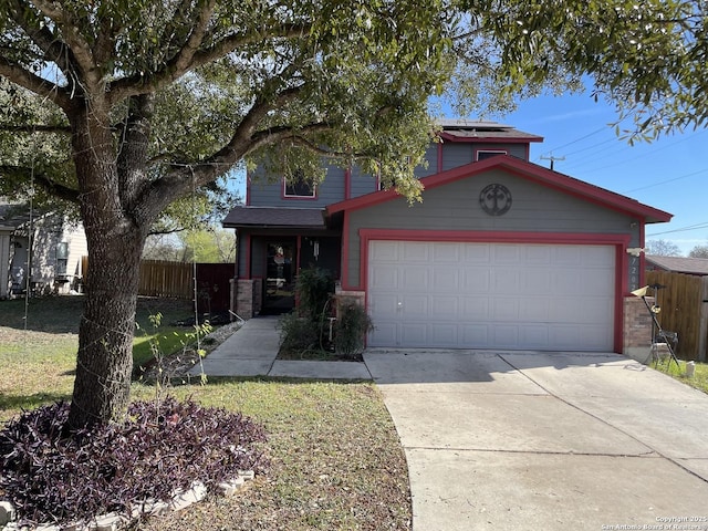 view of front of property featuring solar panels and a garage