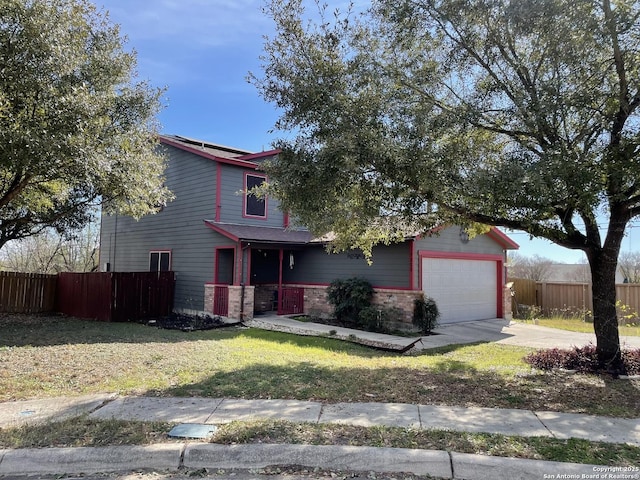 view of front facade featuring a front lawn and a garage