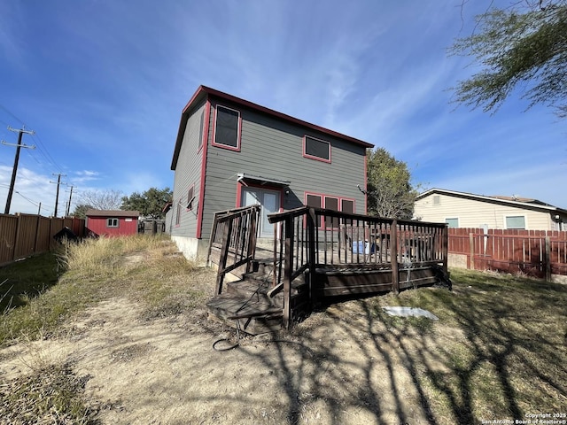 back of property with a wooden deck