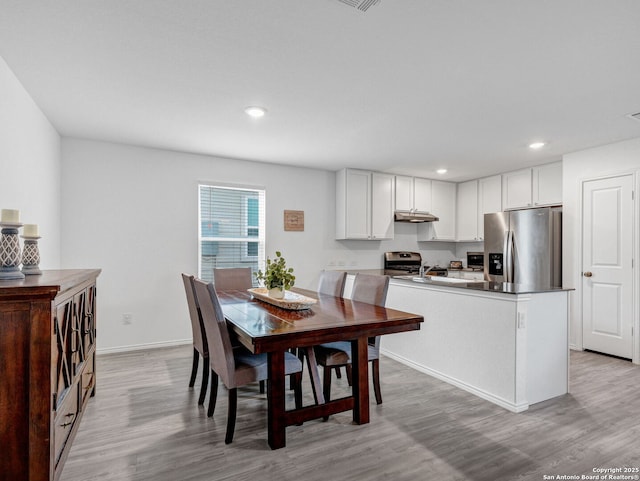 dining room featuring light hardwood / wood-style flooring