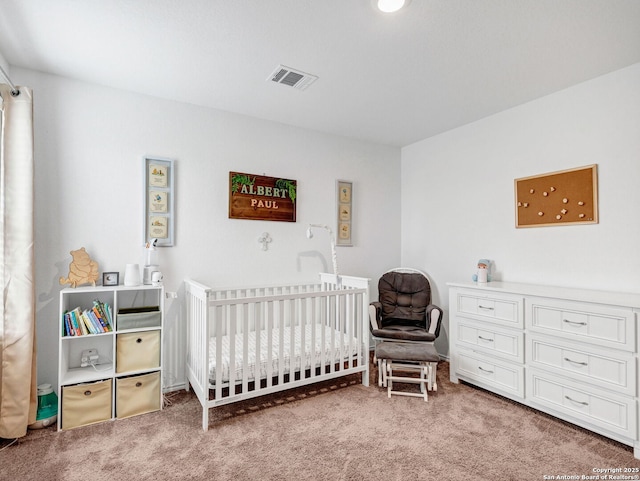 bedroom with carpet floors and a nursery area