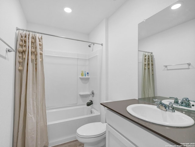 full bathroom featuring toilet, vanity, shower / bath combination with curtain, and hardwood / wood-style floors