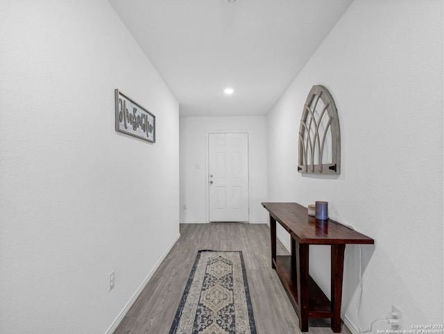 hall with light hardwood / wood-style floors