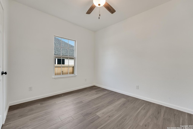 empty room featuring ceiling fan and light wood-type flooring