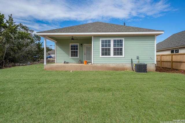 rear view of house featuring ceiling fan, a patio area, cooling unit, and a yard