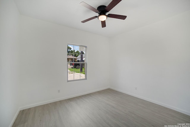 spare room with ceiling fan and light hardwood / wood-style flooring