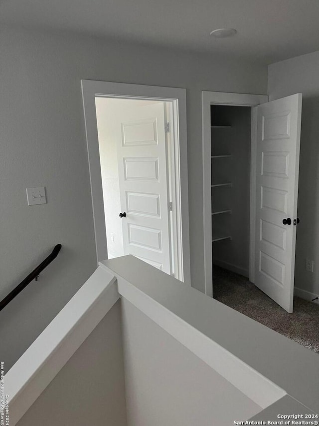 corridor with carpet floors