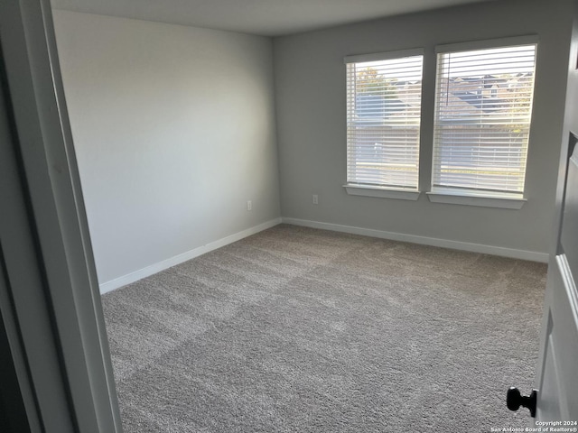 empty room featuring carpet floors