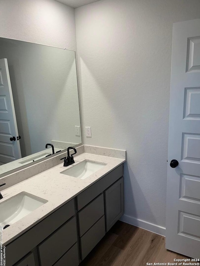 bathroom featuring vanity and hardwood / wood-style floors