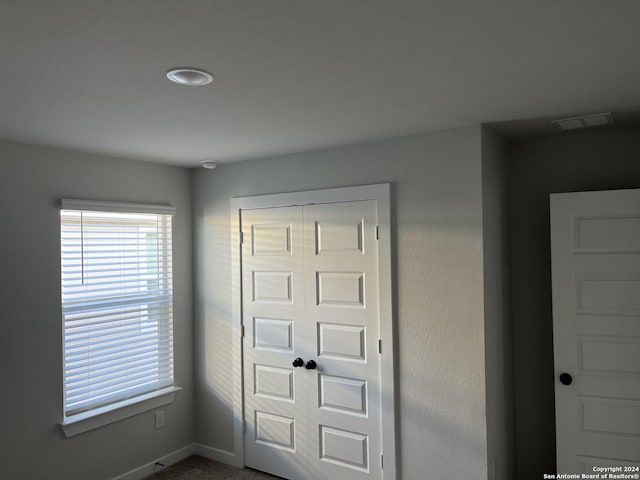 interior space with a closet and carpet flooring