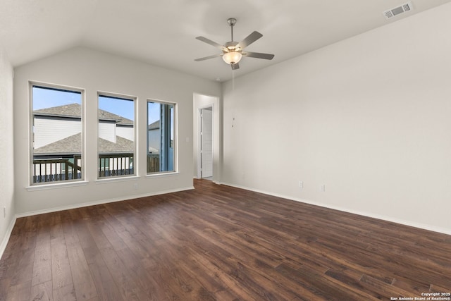 unfurnished room with ceiling fan, lofted ceiling, and dark hardwood / wood-style floors