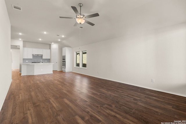 unfurnished living room with dark hardwood / wood-style flooring, lofted ceiling, and ceiling fan