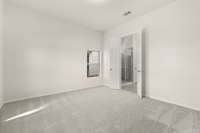 empty room featuring light colored carpet