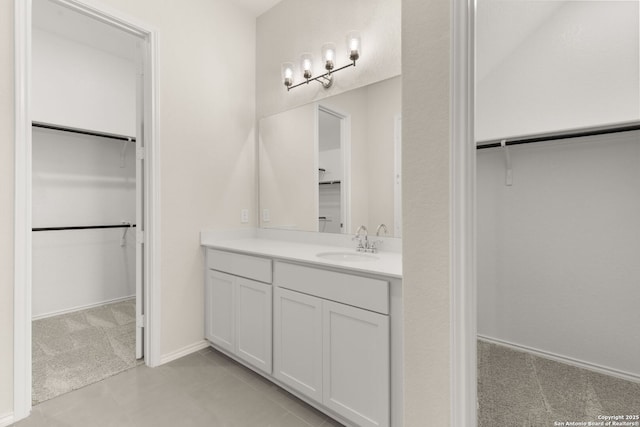 bathroom featuring vanity and tile patterned flooring