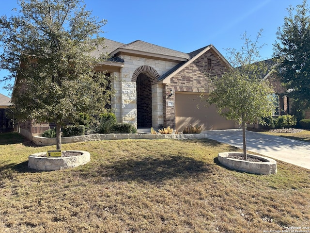 view of front facade featuring a garage and a front lawn