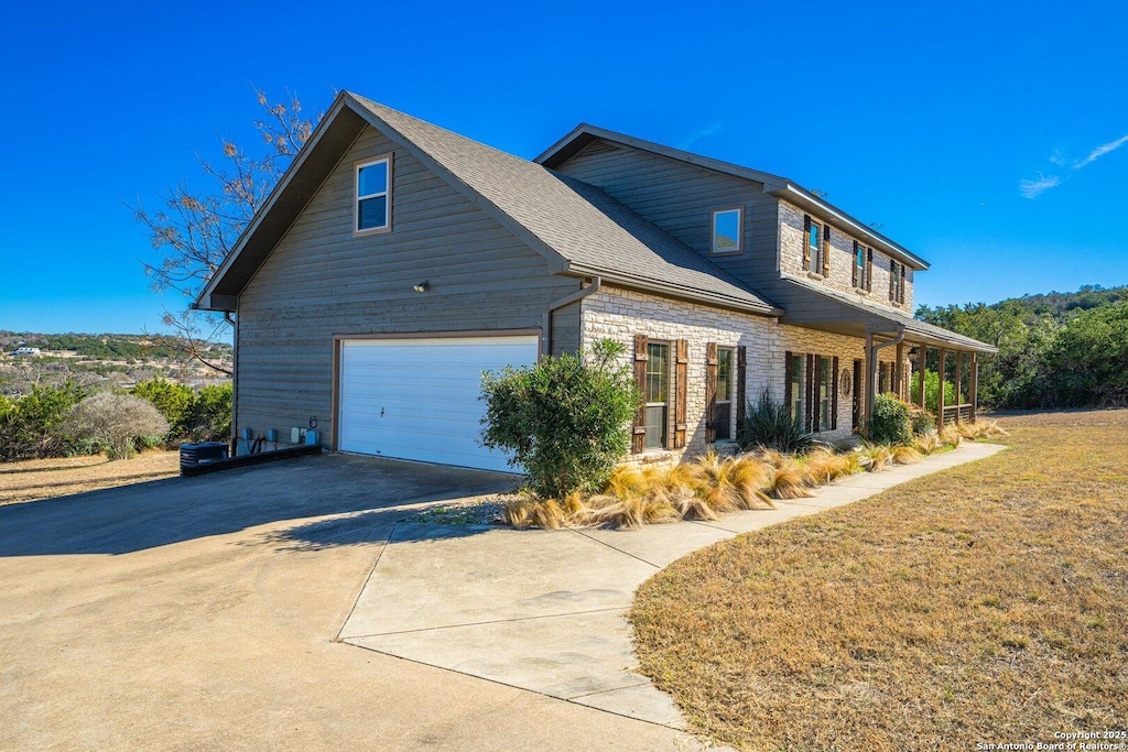 view of side of property featuring a garage