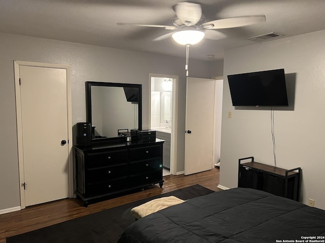 bedroom featuring dark wood-type flooring, ceiling fan, and ensuite bath