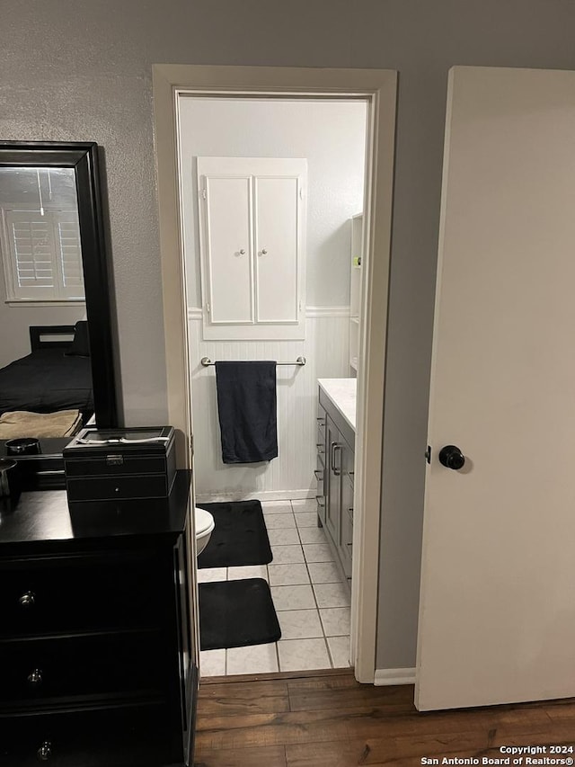 bathroom featuring hardwood / wood-style floors, toilet, and vanity