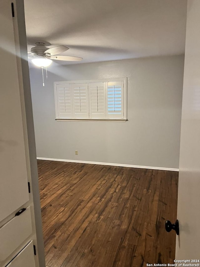 unfurnished room with hardwood / wood-style floors