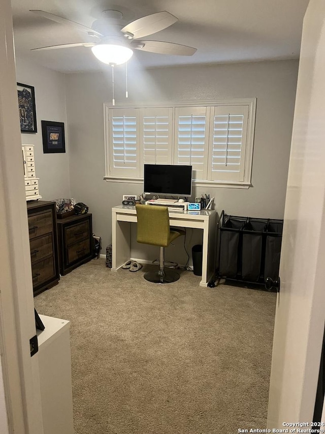 office with ceiling fan and light carpet