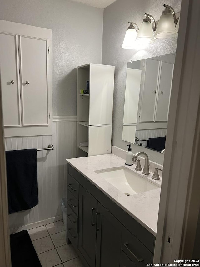 bathroom with vanity and tile patterned flooring