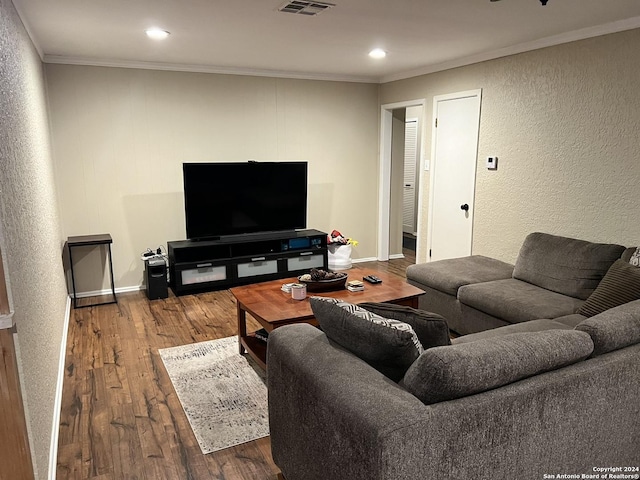 living room with ornamental molding and hardwood / wood-style flooring