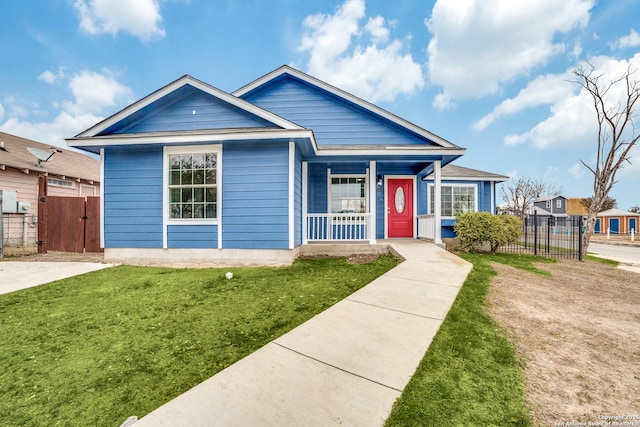 bungalow-style house with a porch and a front yard