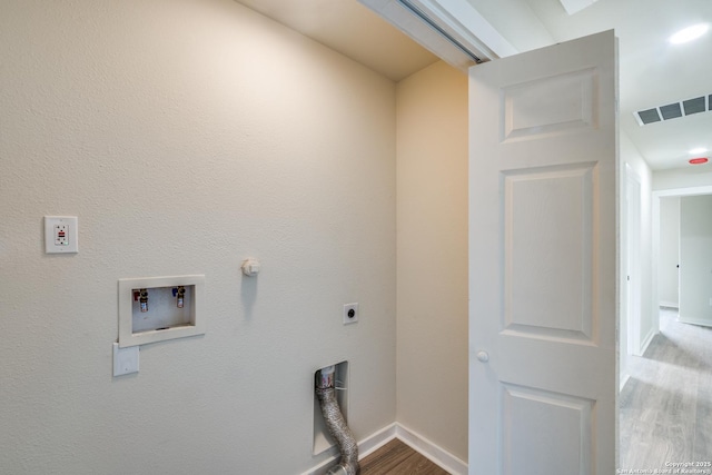 laundry room featuring hardwood / wood-style flooring, washer hookup, and hookup for an electric dryer