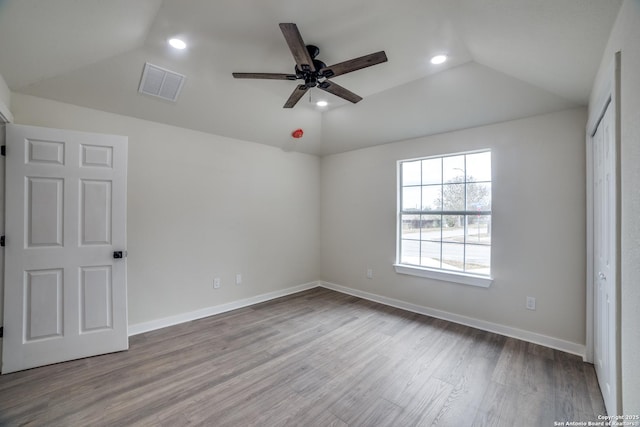 unfurnished bedroom with vaulted ceiling, ceiling fan, and light hardwood / wood-style floors