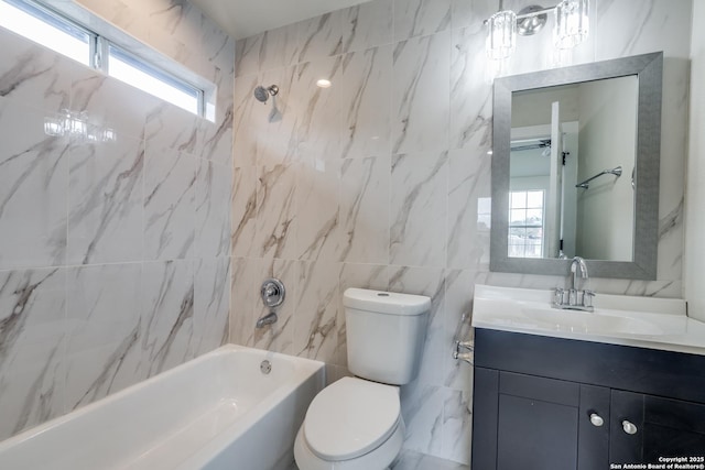 full bathroom featuring toilet, shower / bath combination, tile walls, and vanity