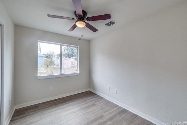 spare room with ceiling fan and hardwood / wood-style floors