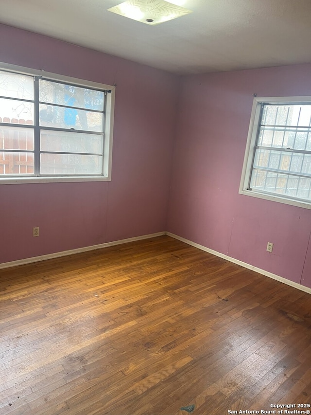 spare room featuring hardwood / wood-style flooring