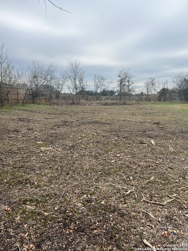 view of yard with a rural view